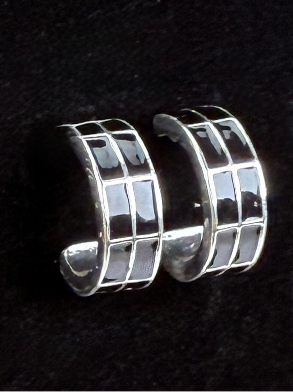 Pretty Silvertone and black half hoop pierced earrings